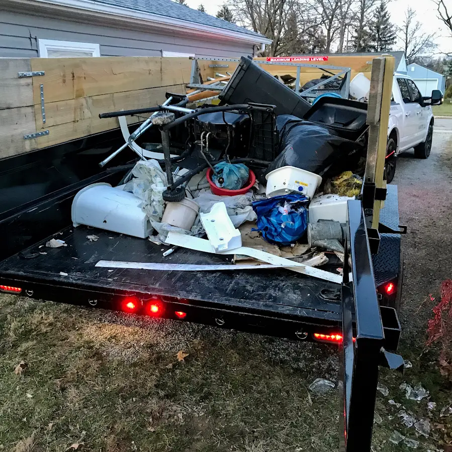 Roll-off dumpster delivered to a residential driveway in Brighton