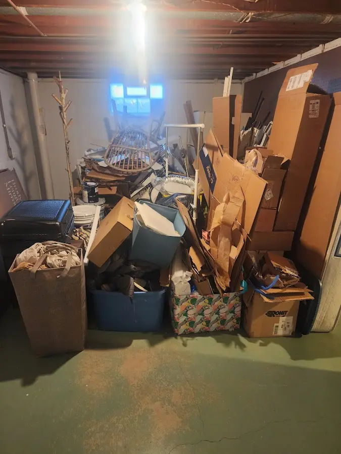 Roll-off dumpster container at job site for 2 Yard Dumpster Rental in Brighton